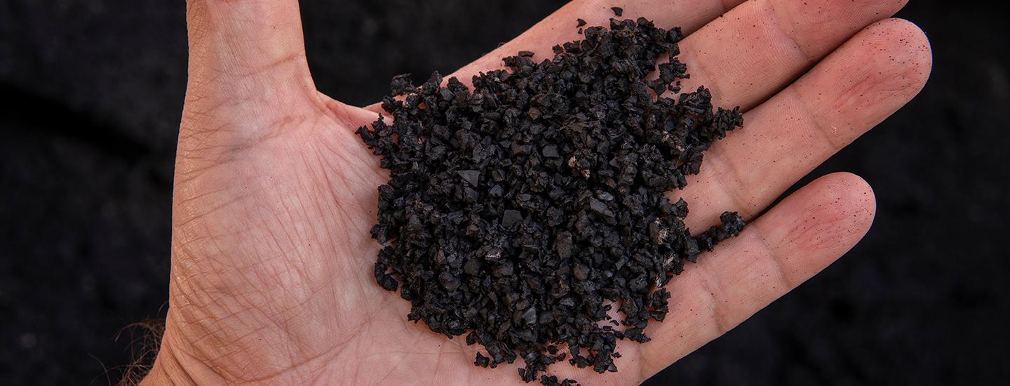 Close-up of recycled rubber pellets, one step of the upcycling process. 